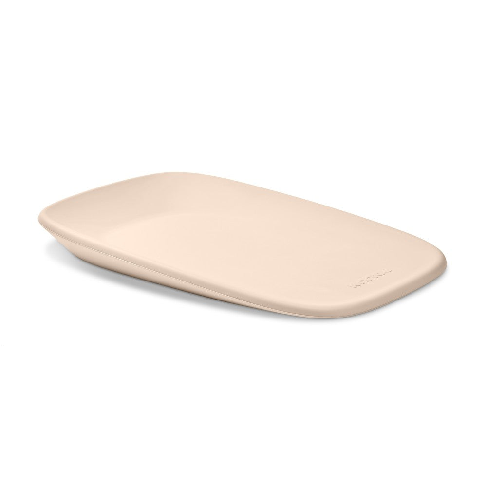 Beige change mat for baby on a white background