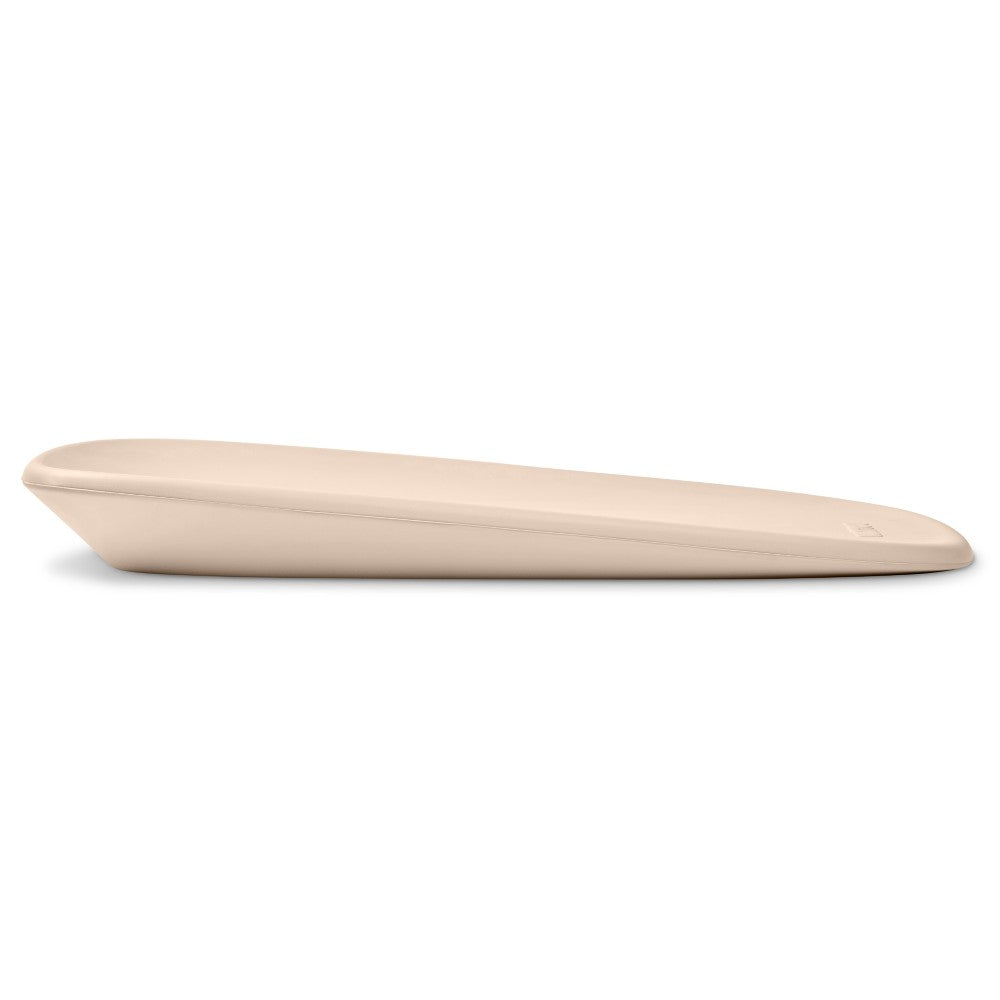 Side view of beige change mat for baby on a white background