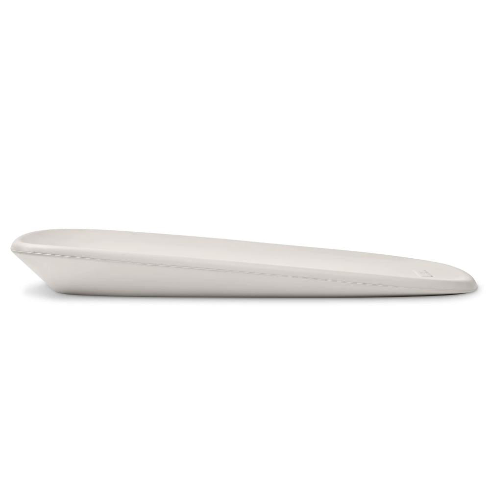 Side view of a grey baby change mat on a white background