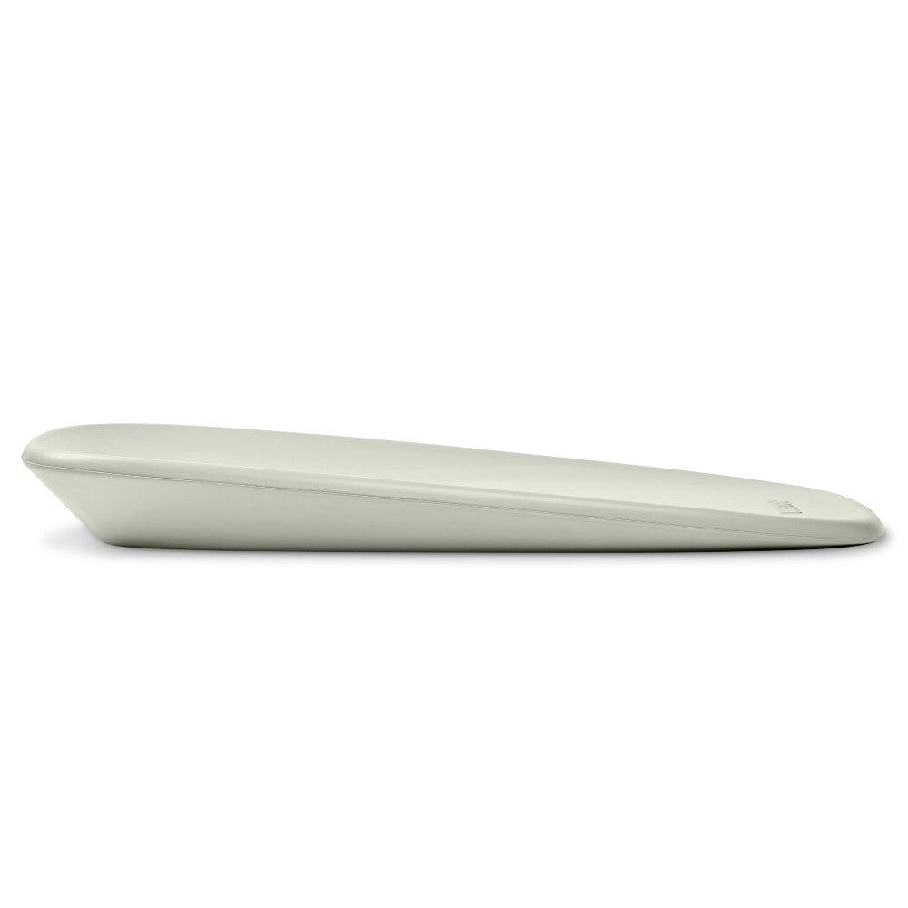 Side view of green baby change mat on a white background