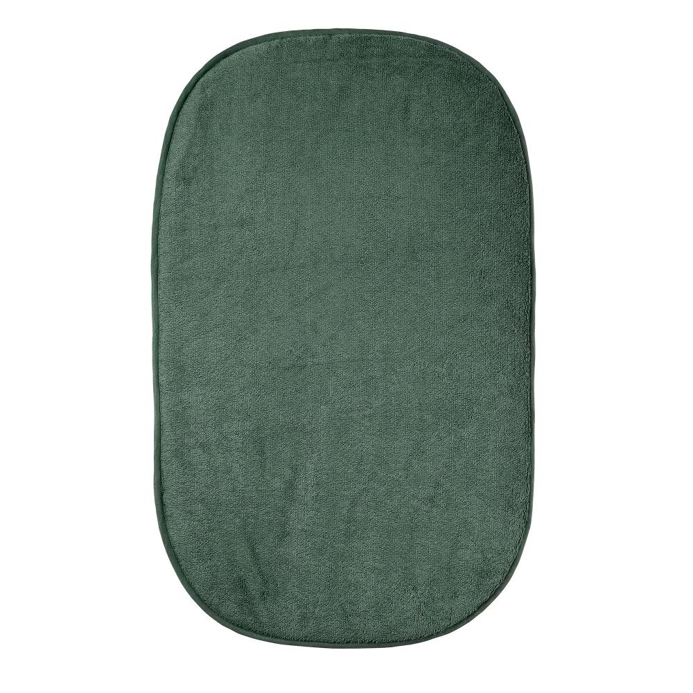 Green changing mat cover on a white background