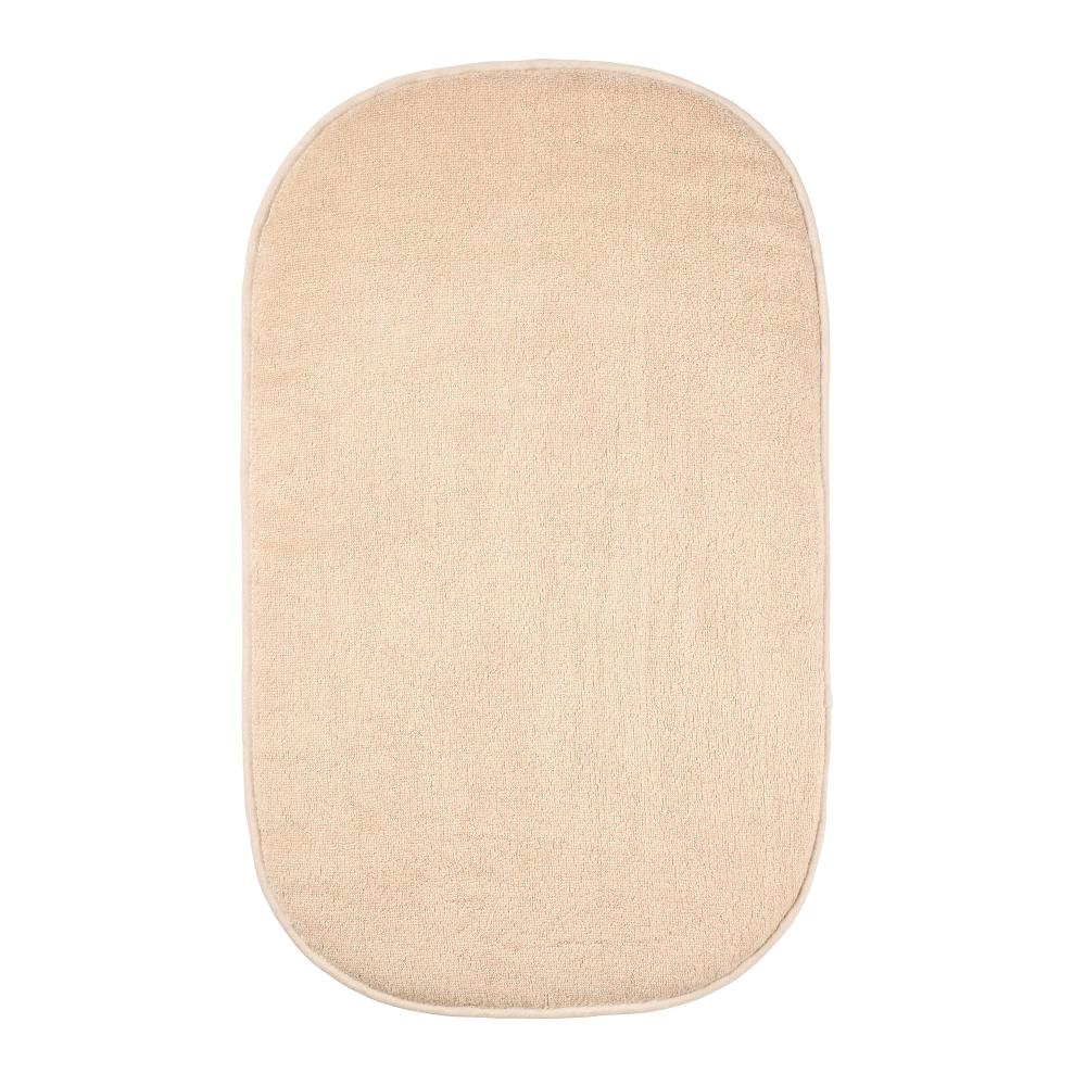 Beige changing mat cover on a white background