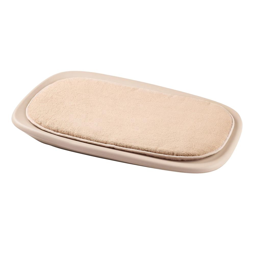 Beige changing mat cover on a white background