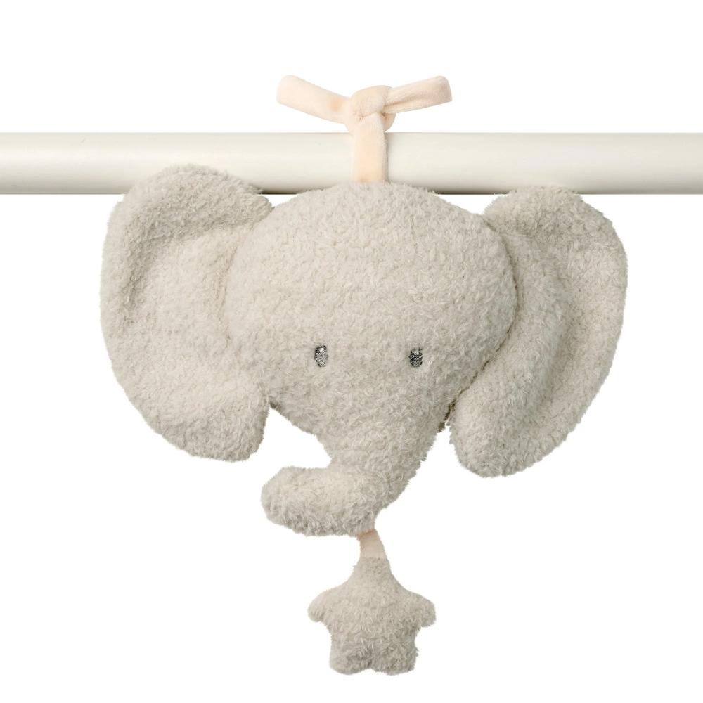 Plush elephant musical toy hanging from a white bar on a white background