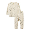 Children's cream pyjama set with long-sleeve top and pants with small purple berry print on a white background