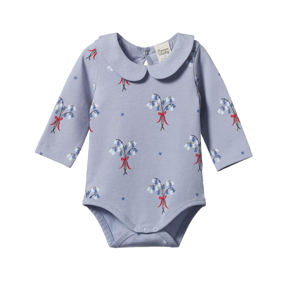 Light blue baby bodysuit with bluebell floral pattern with red bows on a white background