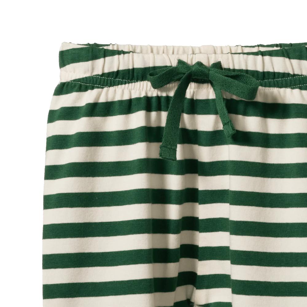 Close up of Green and white striped Nature Baby pants with a drawstring on a white background