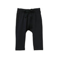 Navy harem-style pants with an elastic waistband and drawstring, shown flat against a white background.