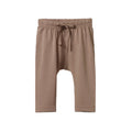 A pair of toddler or baby pants in a solid taupe-brown color, featuring an elastic waistband and a matching drawstring, shown against a plain white background.