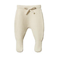 Cream knitted baby pants with a drawstring on a white background