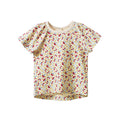 A short-sleeve baby top with a dense floral pattern on a cream background, featuring a ruffled shoulder and snap closures at the collar.