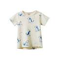 A cream-colored short-sleeve waffle-knit baby t-shirt featuring a blue dog pattern, displayed against a solid white background.