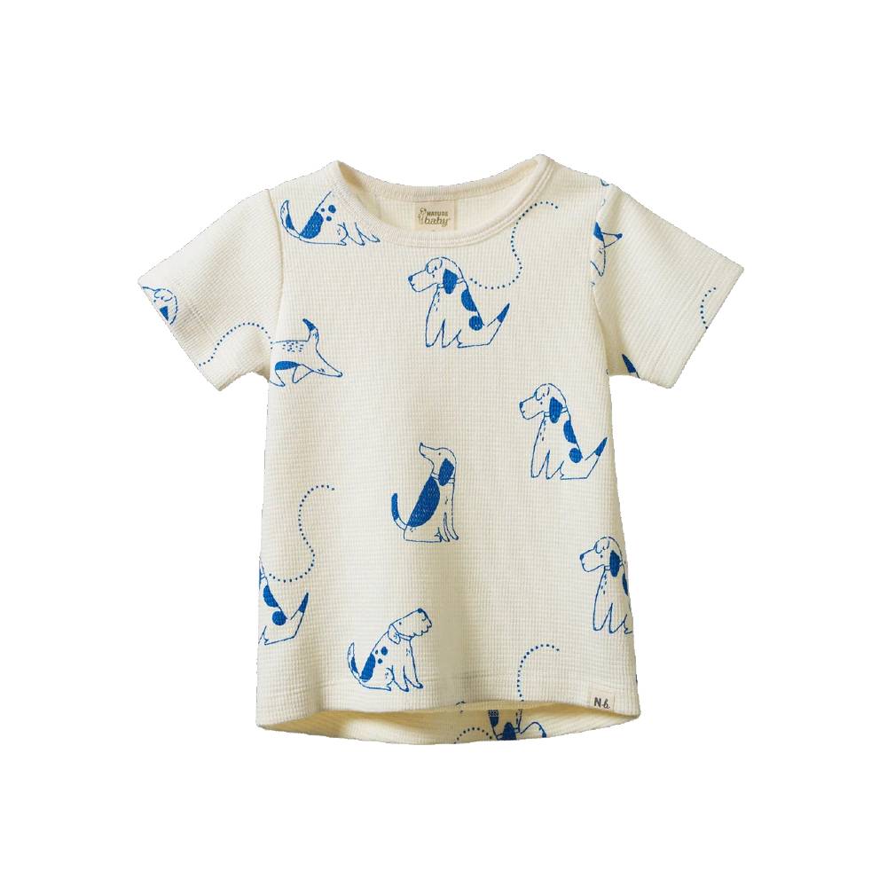 A cream-colored short-sleeve waffle-knit baby t-shirt featuring a blue dog pattern, displayed against a solid white background.
