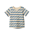 A short-sleeve crewneck t-shirt with a repeating blue and cream wavy horizontal stripe pattern, shown flat against a solid white background.