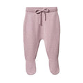 Lilac knitted baby pants with feet and a drawstring on a white background