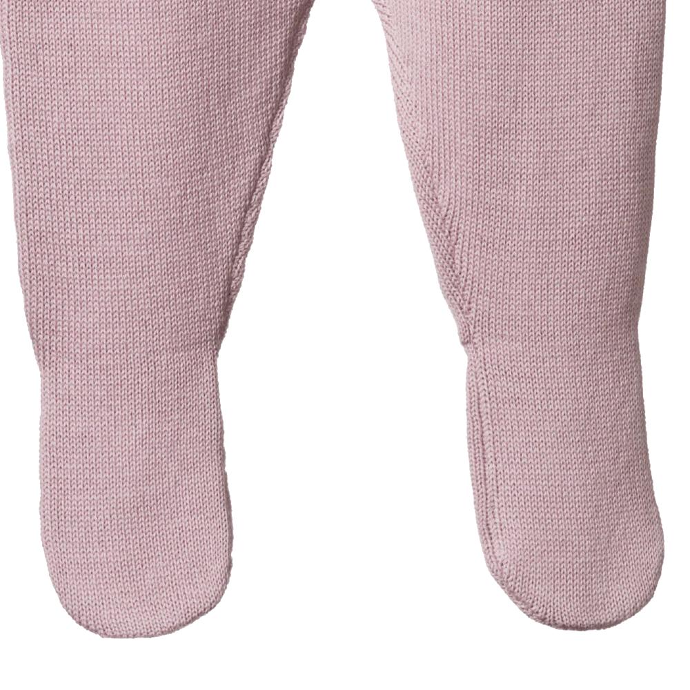 Close-up of soft pink baby footed tights on a white background