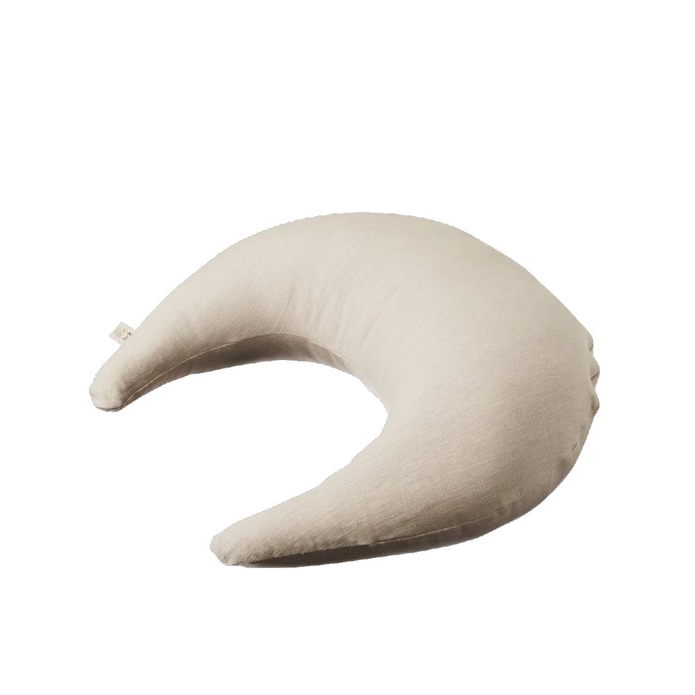 Beige crescent-shaped nursing pillow with linen cover on a white background