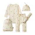 Cotton essentials baby set including a long sleeve bodysuit, knotted beanie, Baby swaddle wrap and leggings. All on a cream base with an instrument all over pattern. 