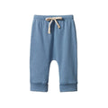 A pair of baby jogger pants in dusty blue, featuring a cuffed ankle, an elastic waistband, and a beige drawstring tied in a bow at the front.