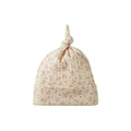 Cotton pointelle knotted beanie with floral print on a white background. 