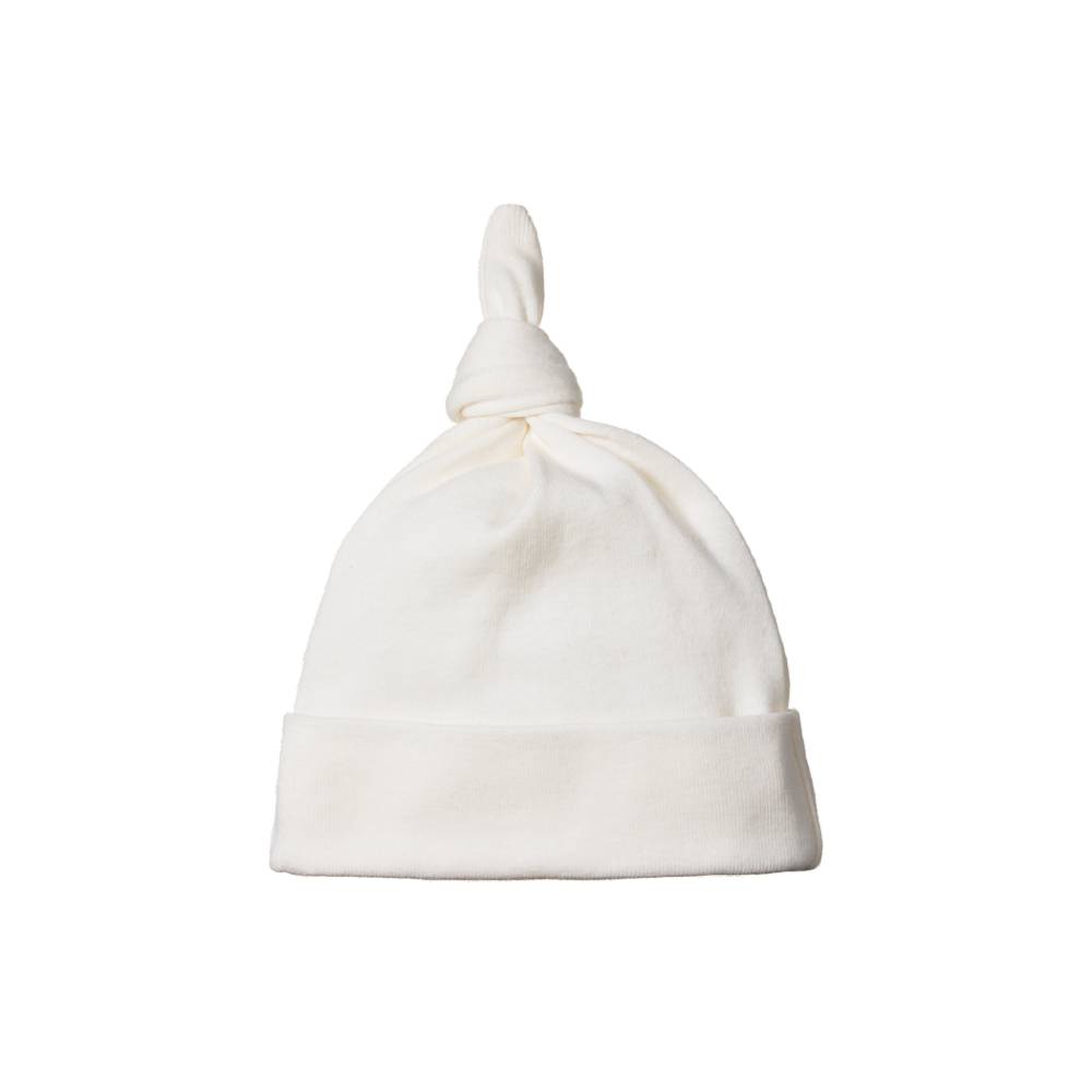 White cotton nature baby hat with a knot on top against a white background