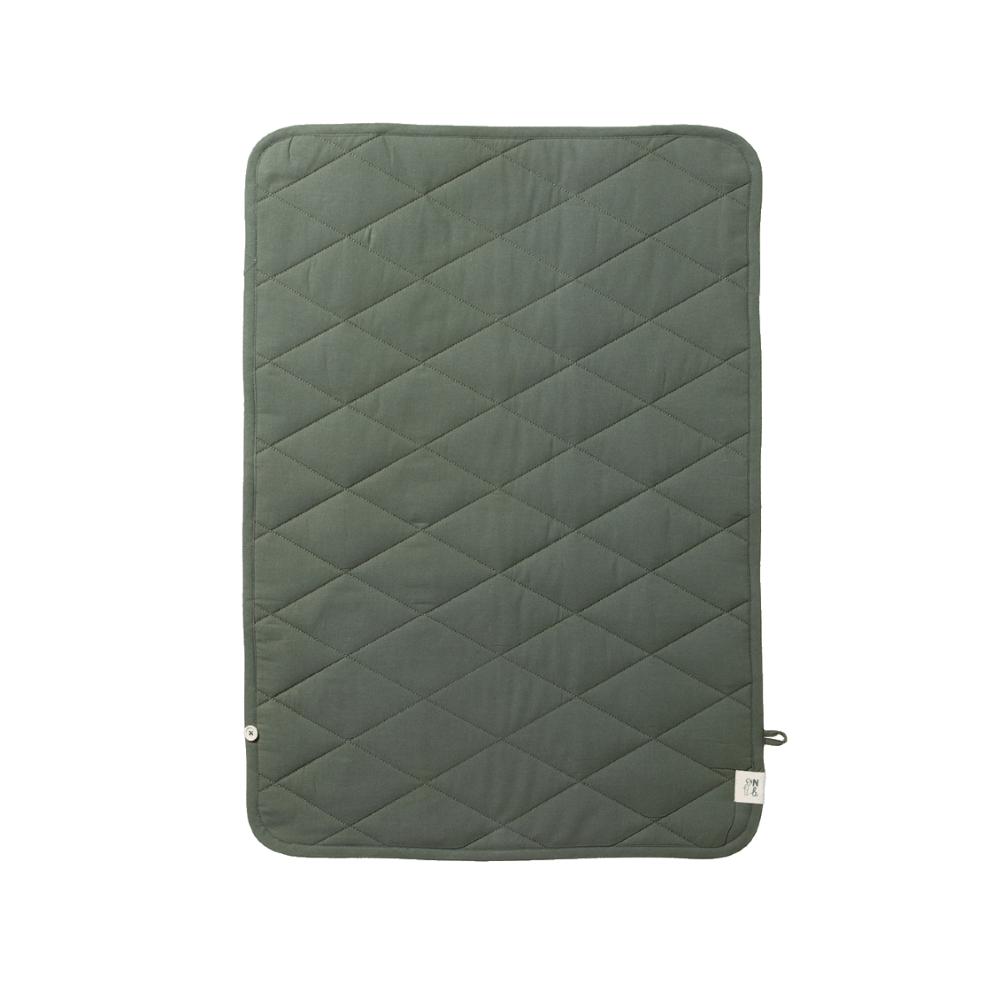 Forest green quilted mat with diamond pattern and branded tag on a white background