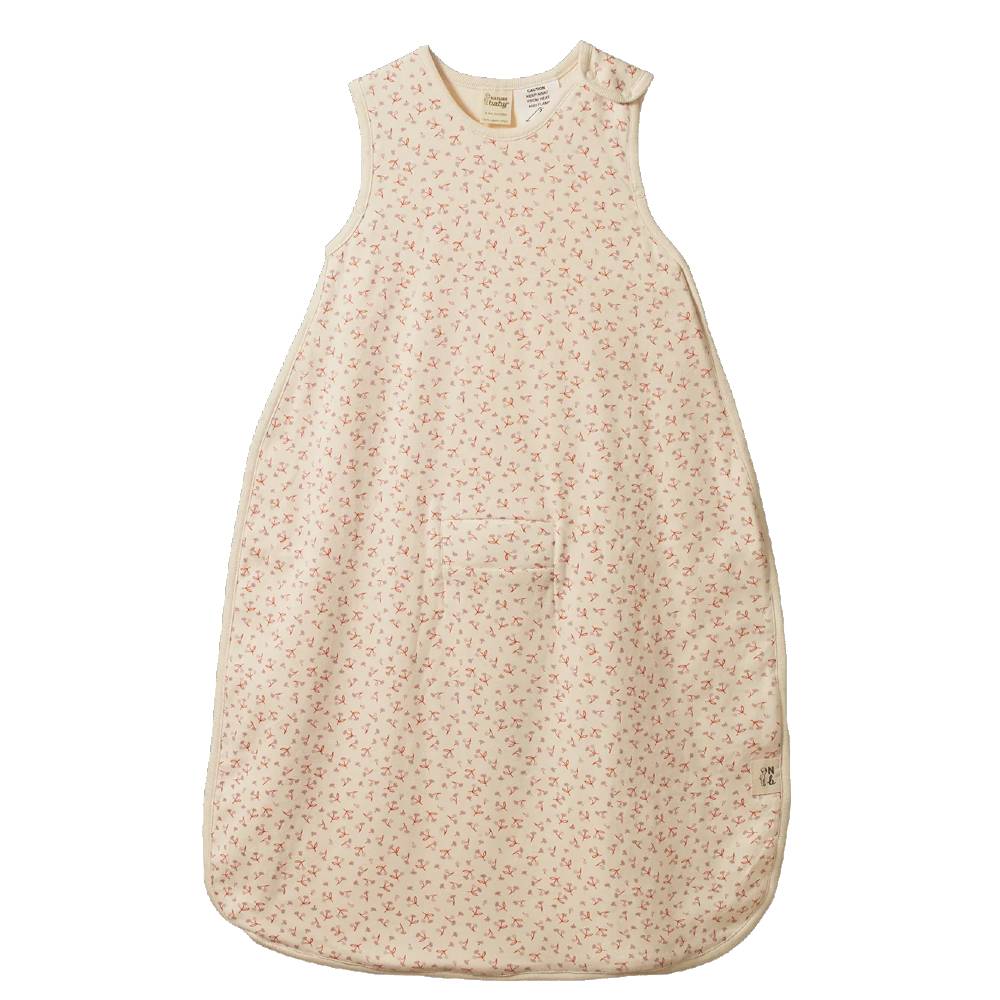 A sleeveless baby sleep bag in a light cream color with a tiny pink floral pattern, laid flat against a white background.