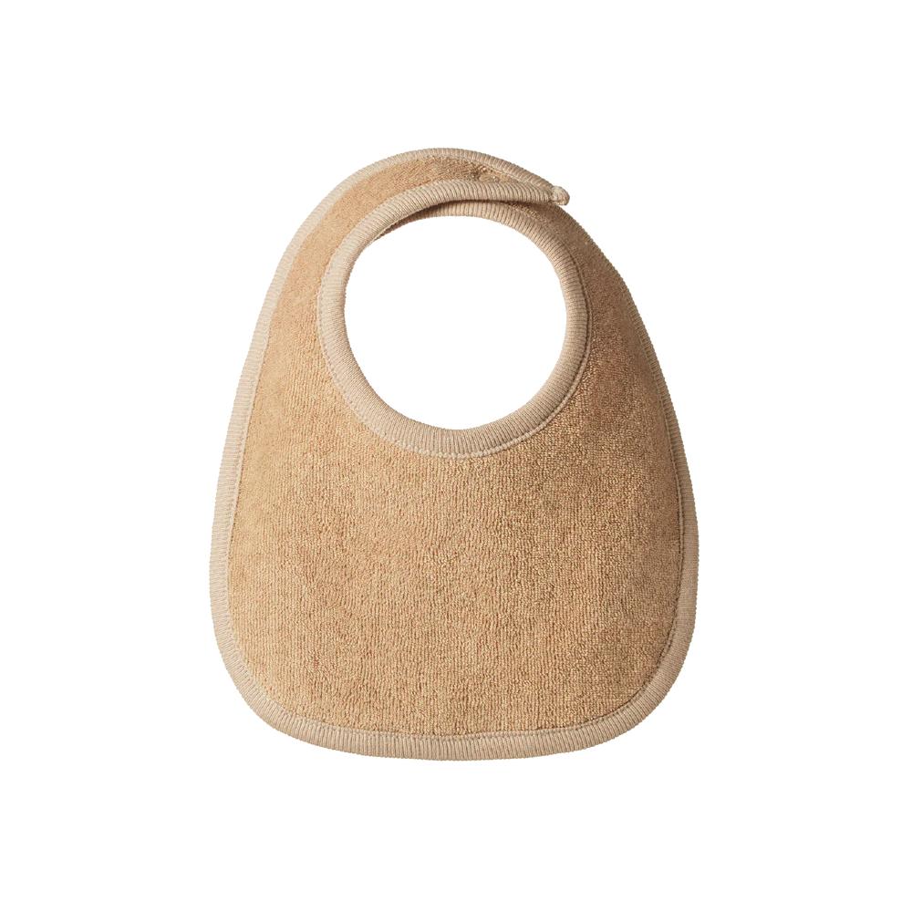 Beige cotton towelling baby bib on a white background