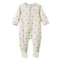 An off-white baby footed sleeper with a green pear pattern, featuring a front zipper closure.