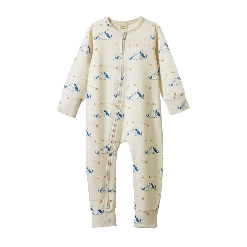 A baby long-sleeve footless one-piece sleeper in cream with a blue and gold dog print, featuring a front zipper closure.