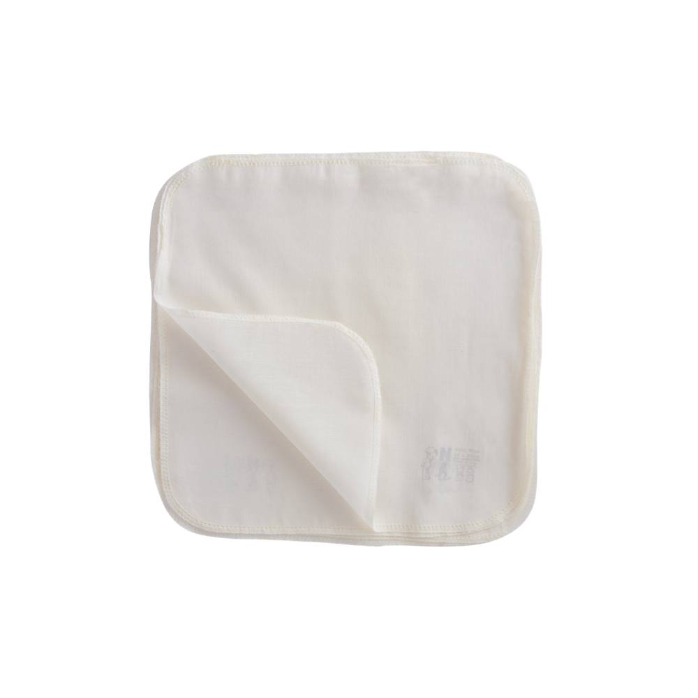 Cream coloured  organic muslin cotton baby face cloths with a small nature baby brand logo visible on a white background