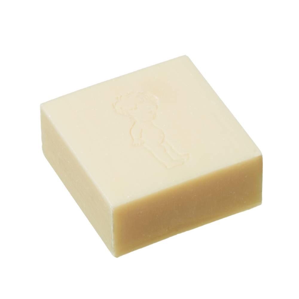 Square bar of soap with Nature Baby stamped on top against a white background