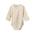 Cotton pointelle long sleeve bodysuit with a floral pattern on a white background. 