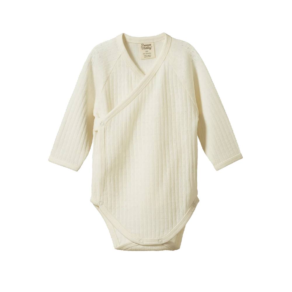 An off-white ribbed pointelle cotton long-sleeve baby kimono bodysuit with a V-neck, displayed flat against a solid white background.