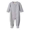Grey organic cotton baby footed onesie with blue heart pattern on a white background