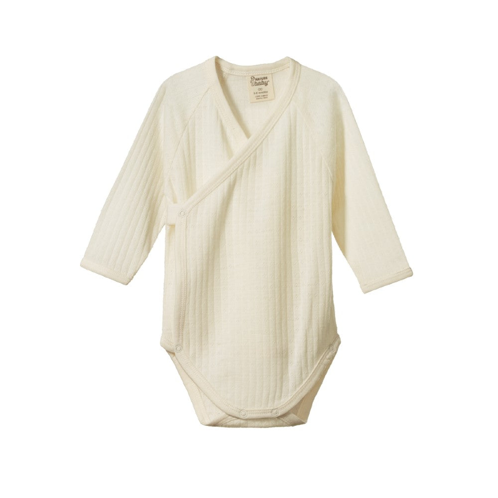 Cream-coloured merino pointell kimono style baby bodysuit on a white background