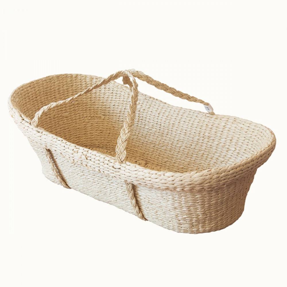 Natural beige Woven baby Moses basket with handle on a white background