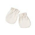 Pair of white cotton baby mittens on a white background