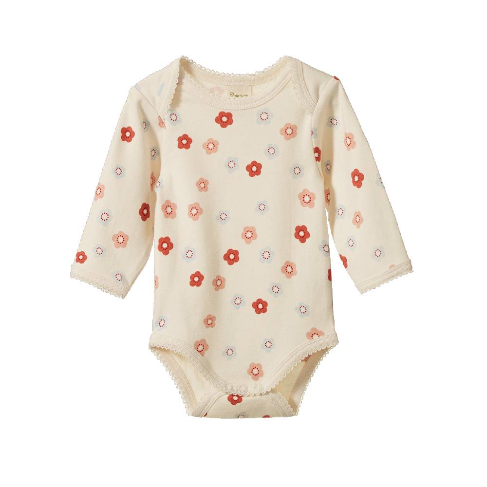 A long-sleeve cream-colored baby bodysuit with a delicate floral pattern in red, orange, and blue, featuring scalloped edges and snap closures.