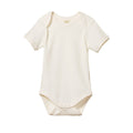 cream cotton baby bodysuit with short sleeves and envelope neck on a white background