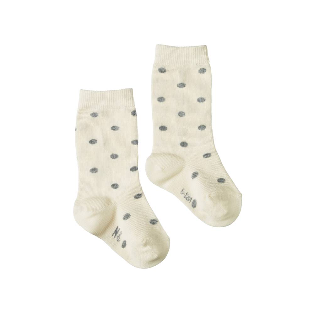 Pair of cotton cream socks with grey polka dots on a white background