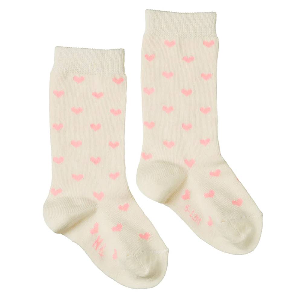 Pair of cotton cream socks with pink heart patterns on a white background