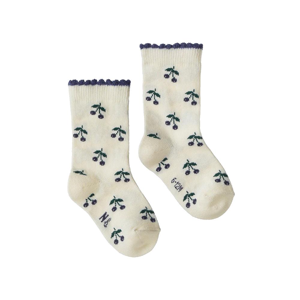 Pair of cream socks with purple berry pattern and purple trim on a white background