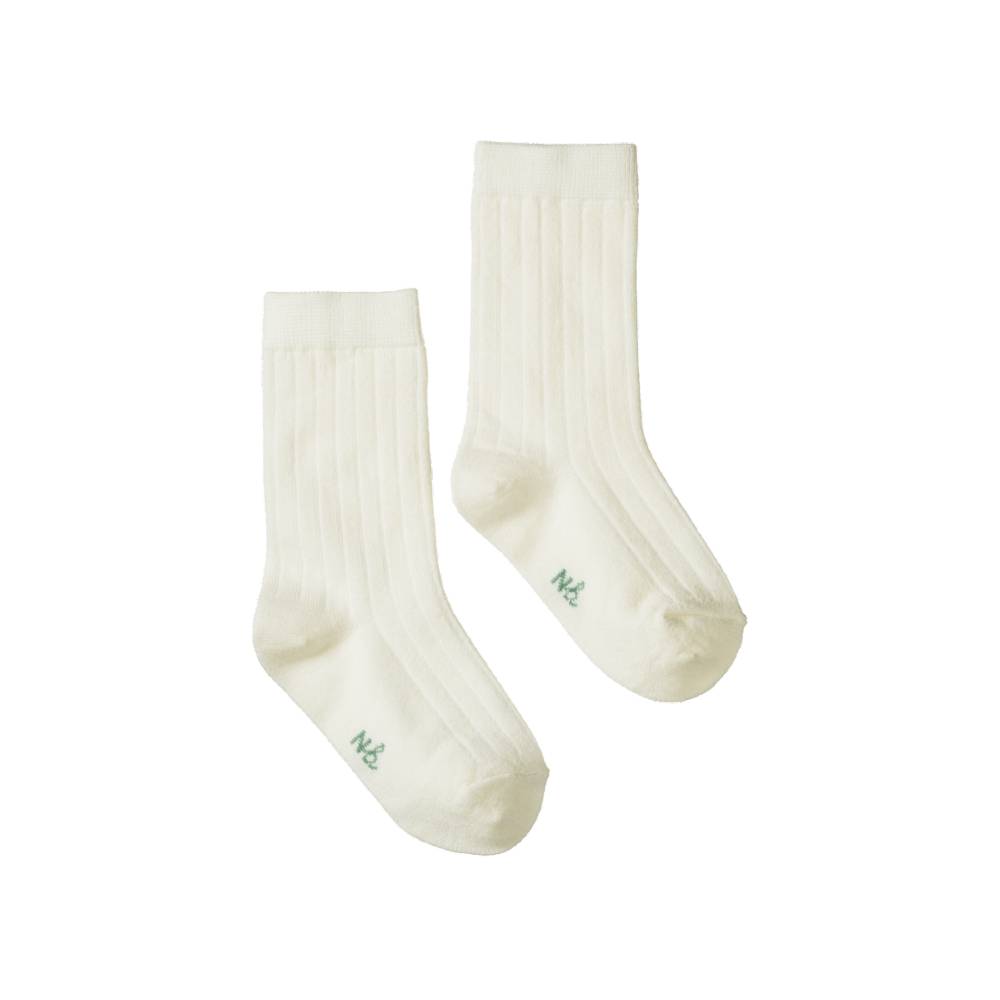Pair of white merino rib wool socks with green 'NB' font on the foot on a white background