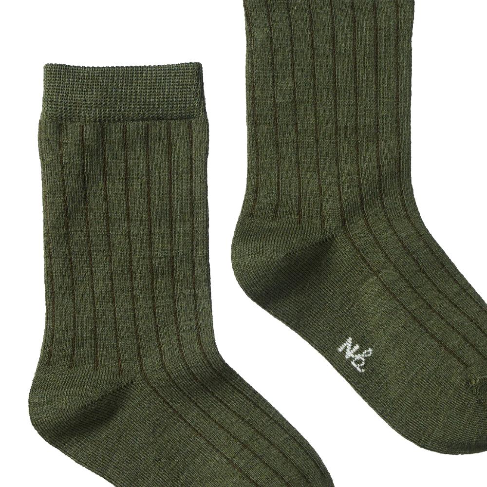 Pair of nature baby merino wool green socks on a white background