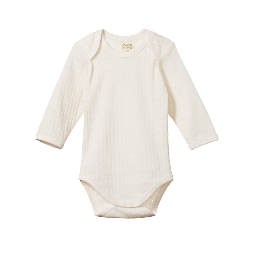 White cotton pointelle baby longsleeve bodysuit on a white background