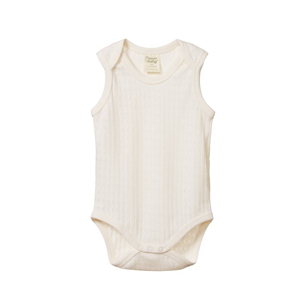 White cotton pointelle sleeveless baby bodysuit on a white background