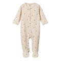 A cream-colored baby footed sleep onesie with a small red and white goose pattern, featuring a snap-button front and long sleeves and legs.