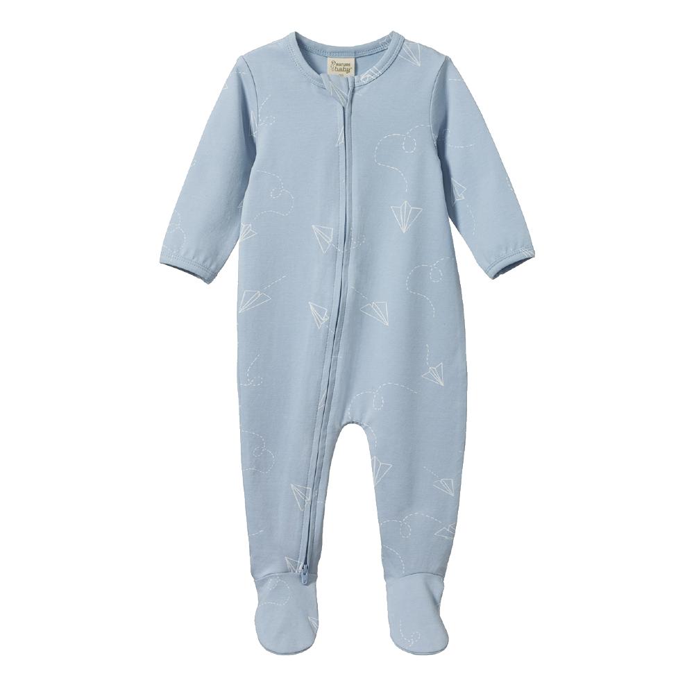 Blue organic cotton jersey baby onesie with zip and white paper aeroplane pattern on a white background