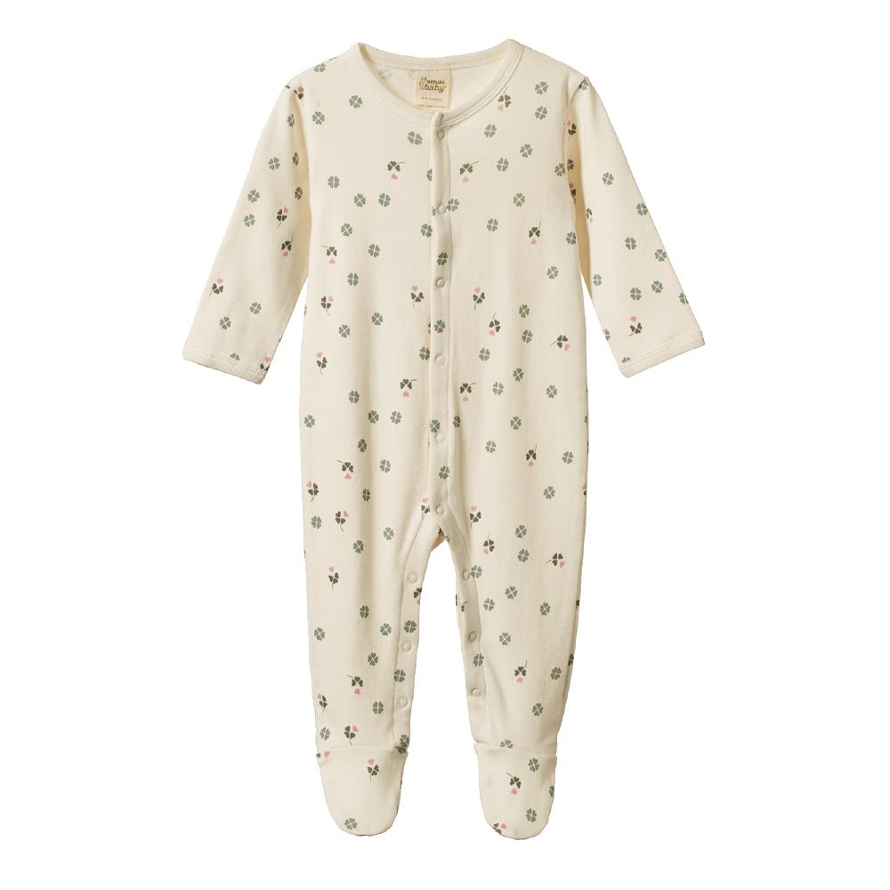 Cream Baby footed onesie with snap buttons with a pink and green clover pattern on a white background